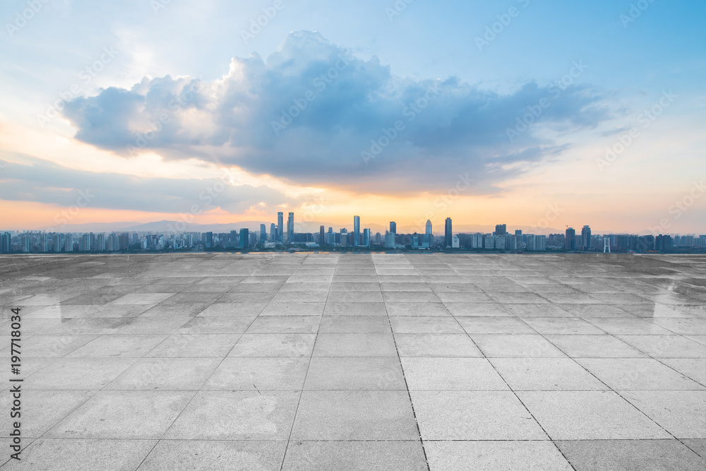 Fototapeta premium empty concrete floor and modern buildings in midtown of singapore in blue cloud sky