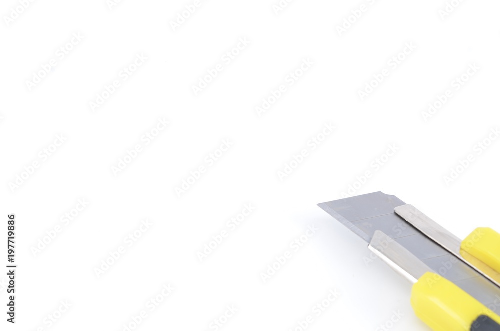 Yellow snap-off blade knife on white background. Yellow snap-off blade knife on white background.