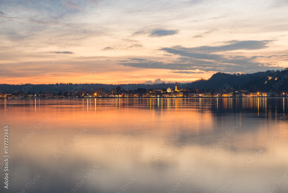 Lake Maggiore, colorful sky at sunset, northern Italy. City of Arona, province of Novara, on the Piedmont side of Lake Maggiore, view from Angera