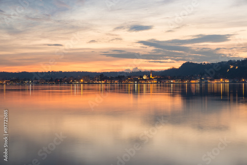 Lake Maggiore  colorful sky at sunset  northern Italy. City of Arona  province of Novara  on the Piedmont side of Lake Maggiore  view from Angera