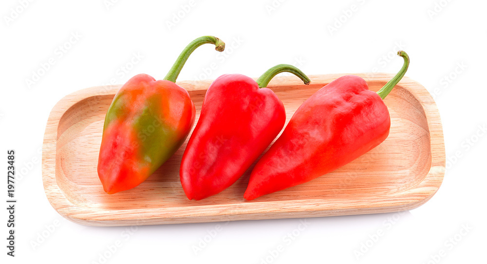Fresh chillies on a white background. Fresh chillies on a white background.