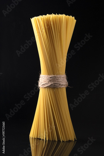 Sheaf of pasta on a black background