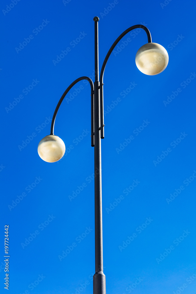 street lights on high pillars and blue sky street lights on high pillars and blue sky