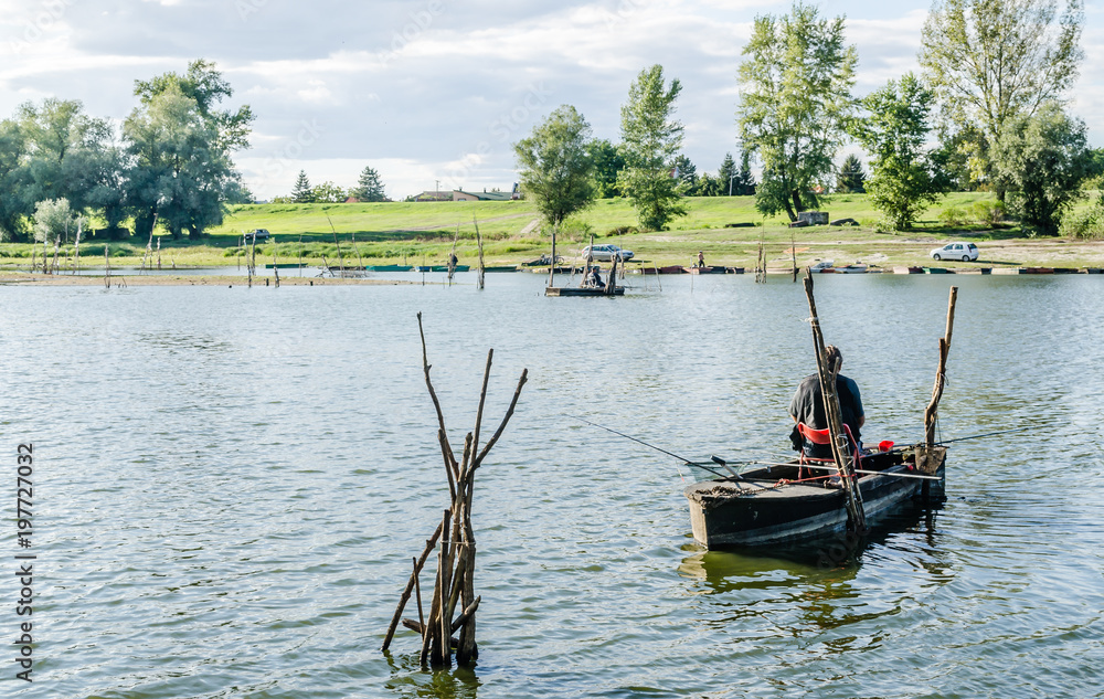 Obraz premium Novi Sad, Serbia - June 20, 2015: Fisherman on the artificial lake near the town of Novi Sad 