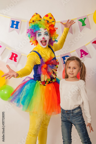 clown girl on the birthday of a child. A party for a child. Fun and smile