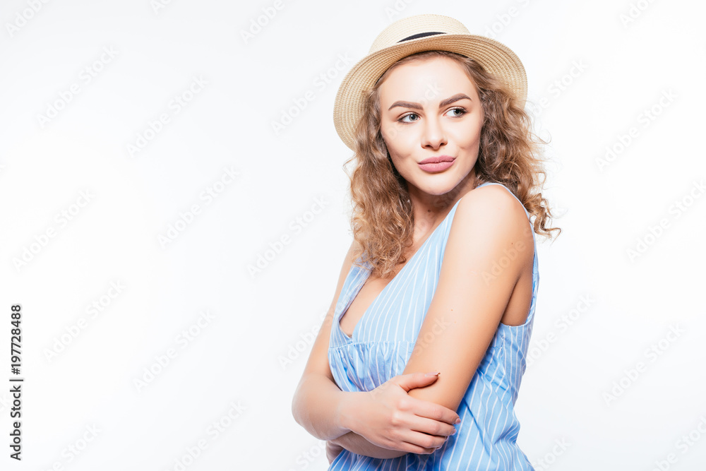 Portrait of a smiling attractive woman in summer dress and hat Portrait of a smiling attractive woman in summer dress and hat