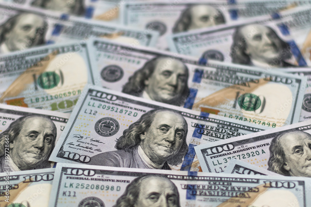 One hundred dollars, new 100 US dollar, background of money. Concept finance, investments, deposits. One hundred dollars, new 100 US dollar, background of money. Concept finance, investments, deposits.