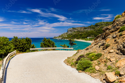Picturesque turn of the road on the beach. The scenic Potami beach, a popular destination on the Greek island of Samos, Greece