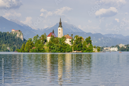 Lake Bled with St. Marys Church of Assumption on small island. Bled, Slovenia, Europe. Mountains and valley on background. 