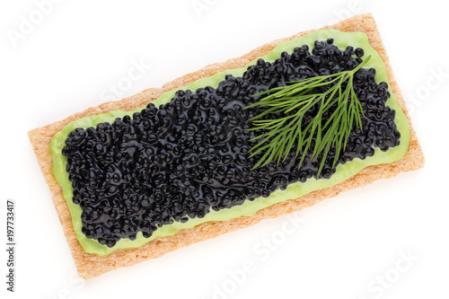 Canapes with black sturgeon caviar and spice isolated on the white background.