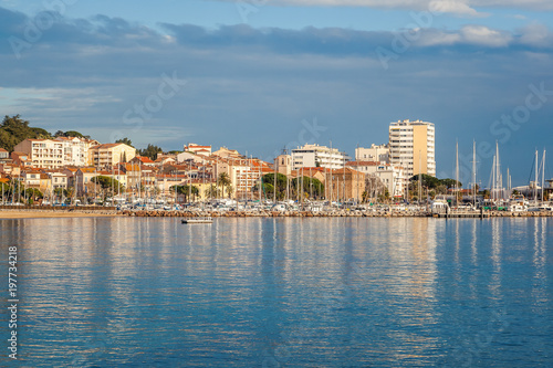 City and sea landscape, the city of Saint-Maxime on the Cote d'Azur, Var, France, a popular destination for summer holidays in Europe photo
