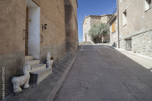 Village street view and church in village of Santa Maria Olo, moianes region comarca, province Barcelona, Catalonia.Spain. photo