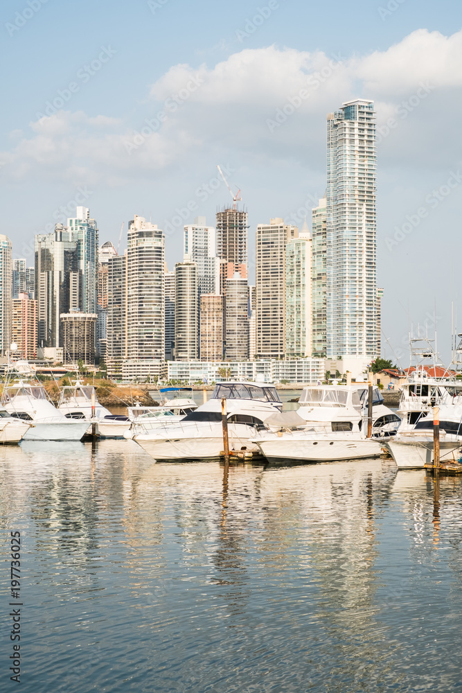 Obraz premium Vacations and Tourism Concept - modern yachts at harbor, Panama City skyline