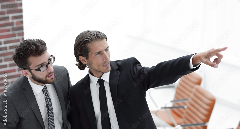 business partners standing in the office. business partners standing in the office.