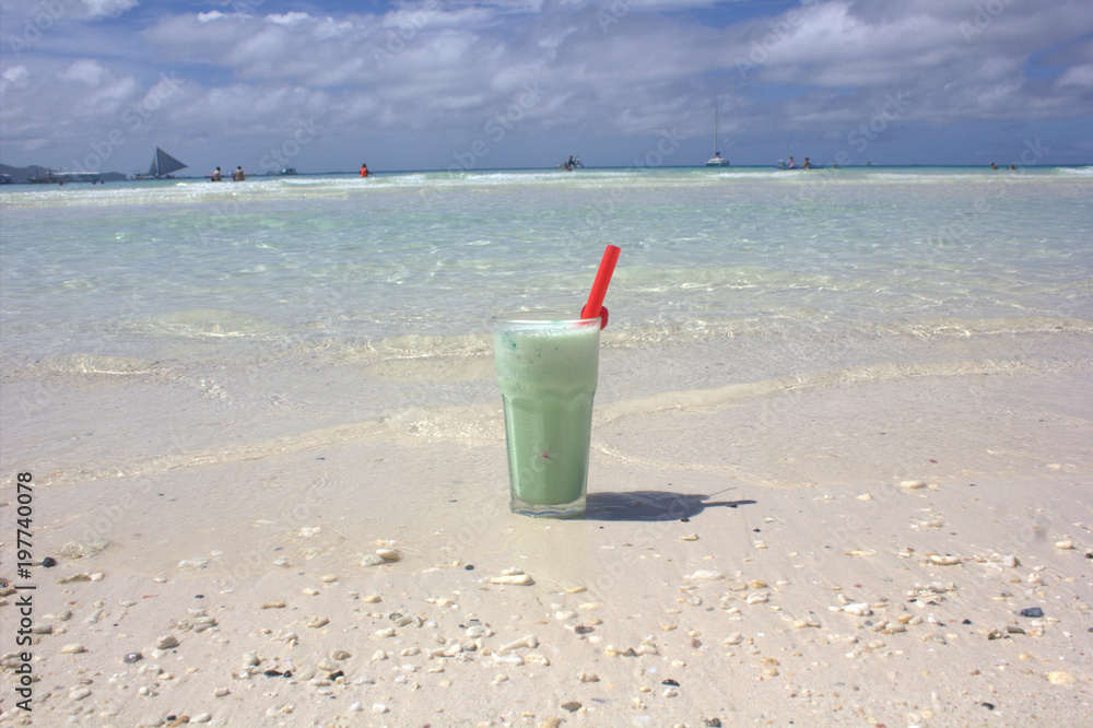 cocktail from a kiwi with milk on the beach cocktail from a kiwi with milk on the beach
