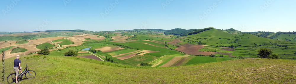 Biker admiring scenery hills in Transylvania