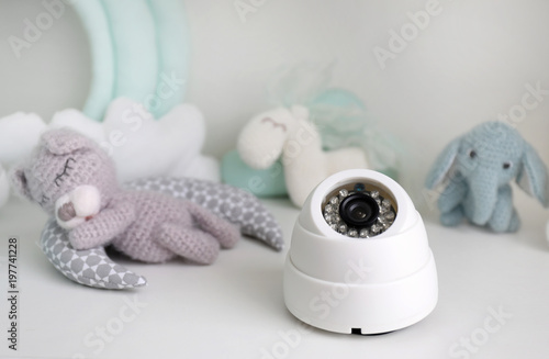 Baby monitor and toys on table