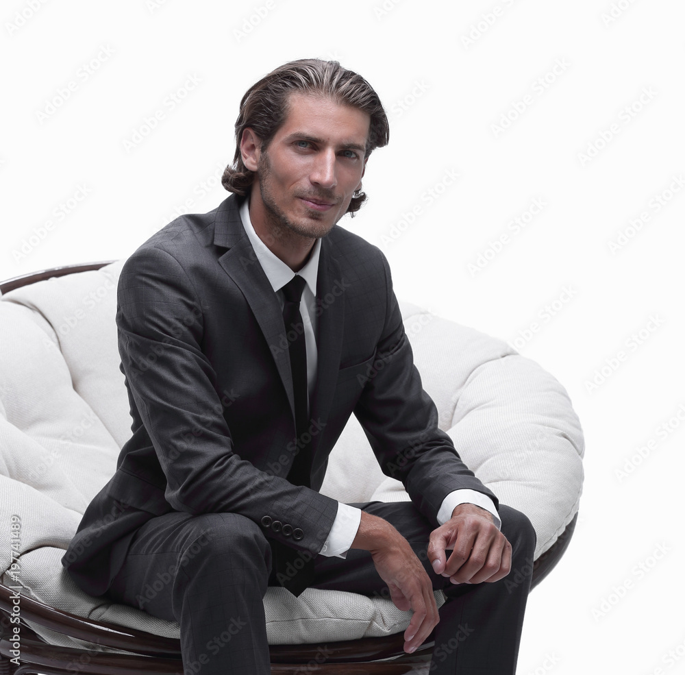 businessman sitting in a comfortable big chair businessman sitting in a comfortable big chair