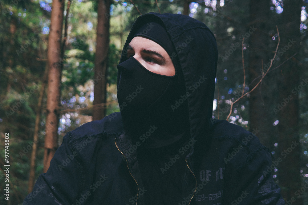 man in a black, mysterious mask Stock Photo | Adobe Stock