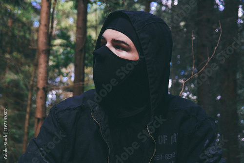 man in a black, mysterious mask