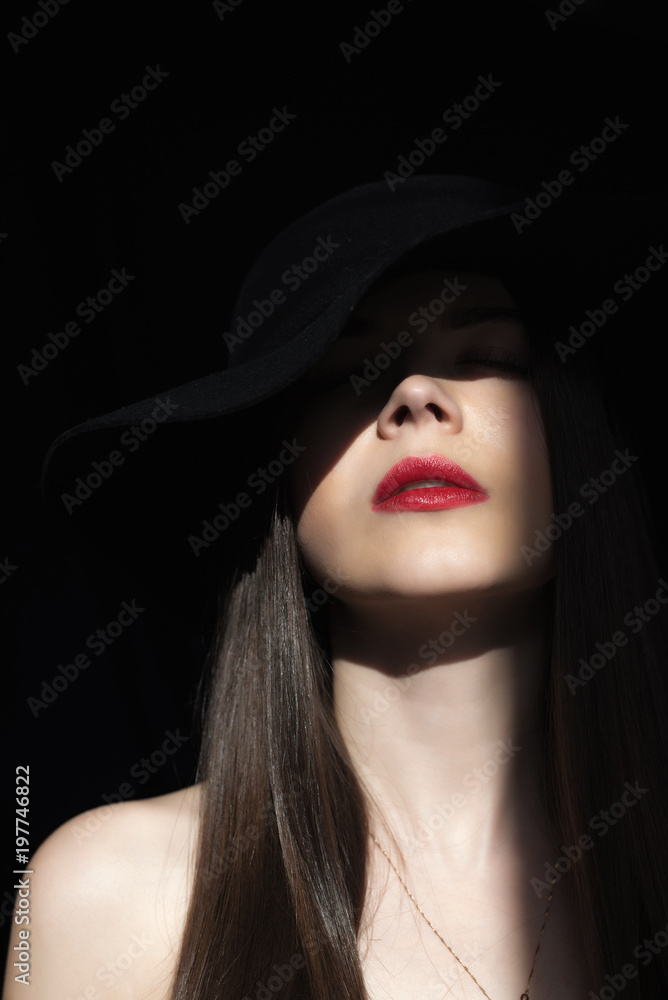 The ray of the sun lights the girl in the dark. The ray of the sun lights the girl in the dark.