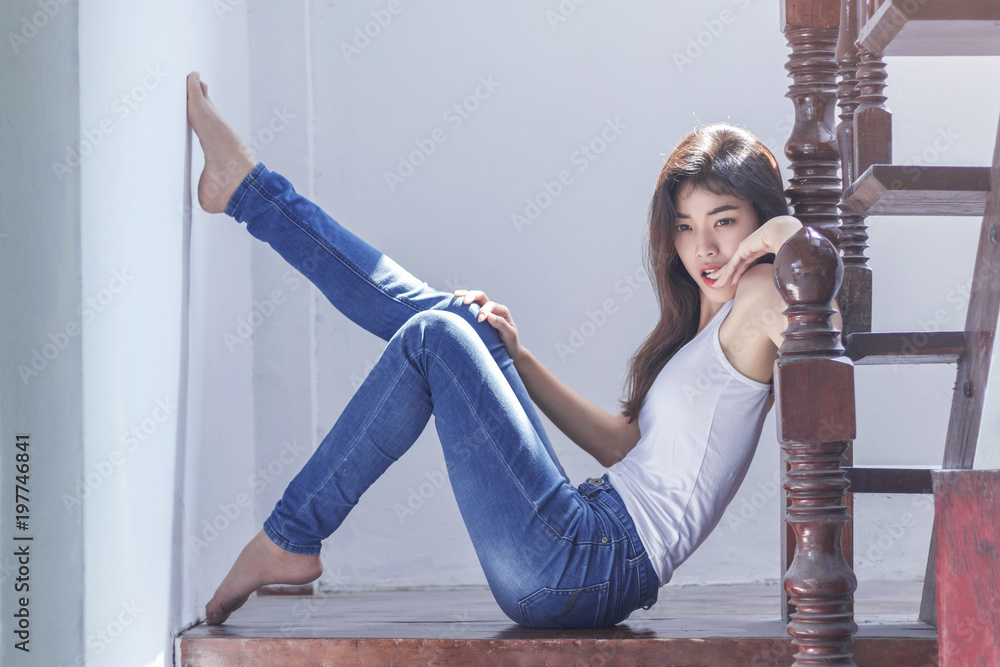 Sexy asian girl in blue denim jean and white shirt Stock Photo | Adobe Stock