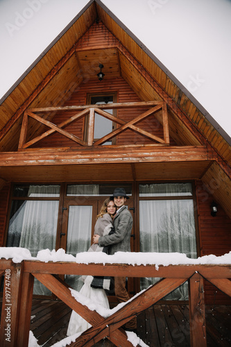 Wallpaper Mural a young couple in tights at a wedding photo shoot in winter. The wedding couple is fooling around and having a good time Torontodigital.ca