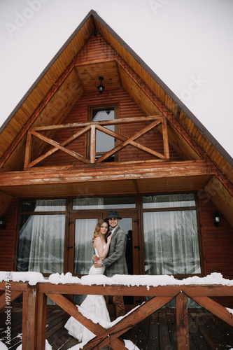 Wallpaper Mural a young couple in tights at a wedding photo shoot in winter. The wedding couple is fooling around and having a good time Torontodigital.ca