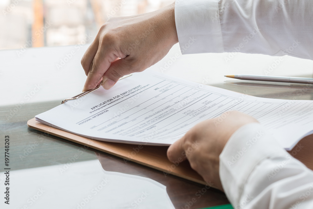 Applicant filing in company application form document applying for job, or registering claim for health insurance Applicant filing in company application form document applying for job, or registering claim for health insurance