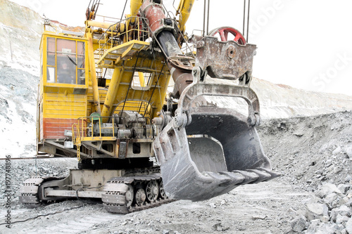 Bucket excavator volume of 10 meters cubic. A close-up of a bucket of a large excavator in a quarry.