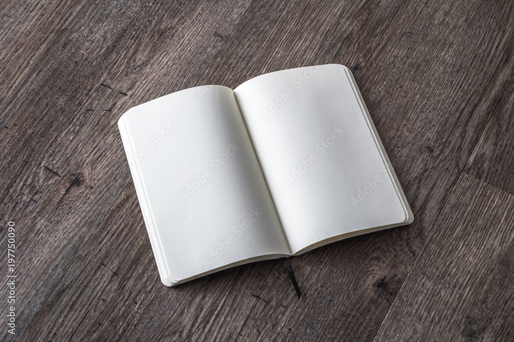 Fototapeta premium Blank book mock up, catalog, magazines, brochure, or note cover template, white paper texture on wood table