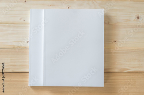 Two Blank A4 size book cover mockup template with page front side on white surface on wood table