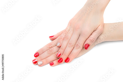 Fototapeta Naklejka Na Ścianę i Meble -  Female's hands with red manicure on white background.