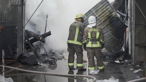 Firefighters on fire. Fireman extinguishes the fire with water. External market is on fire.