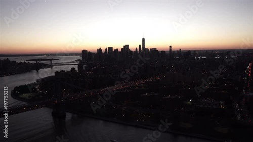 New York City aerial view of Lower Manhattan at dusk from the East River, by the Williamsburg Bridge