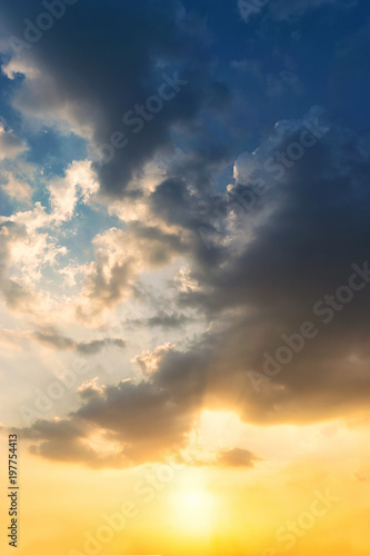 Fototapeta Naklejka Na Ścianę i Meble -  Sky blue and orange light of the sun through the clouds in the sky