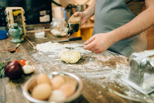 Homemade pasta cooking  dough preparation on table