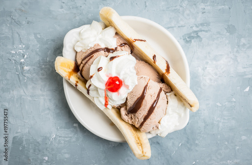 Homemade banana split with on the rustic background. Selective focus. photo
