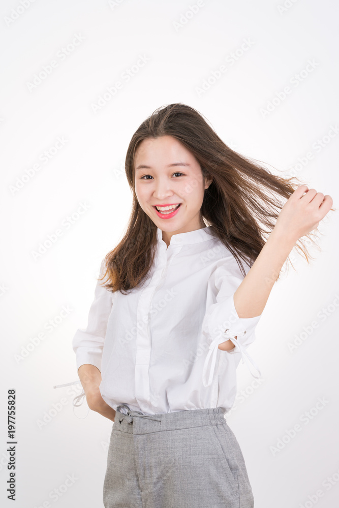 Smiling Young Woman touching her Long and Healthy Hair. Portrait of Young Business Woman.
Smiling Young Woman touching her Long and Healthy Hair. Portrait of Young Business Woman.