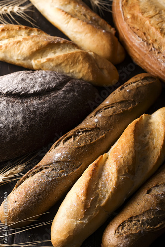 Fresh baked bread background, variety of different kind of breads, food industry