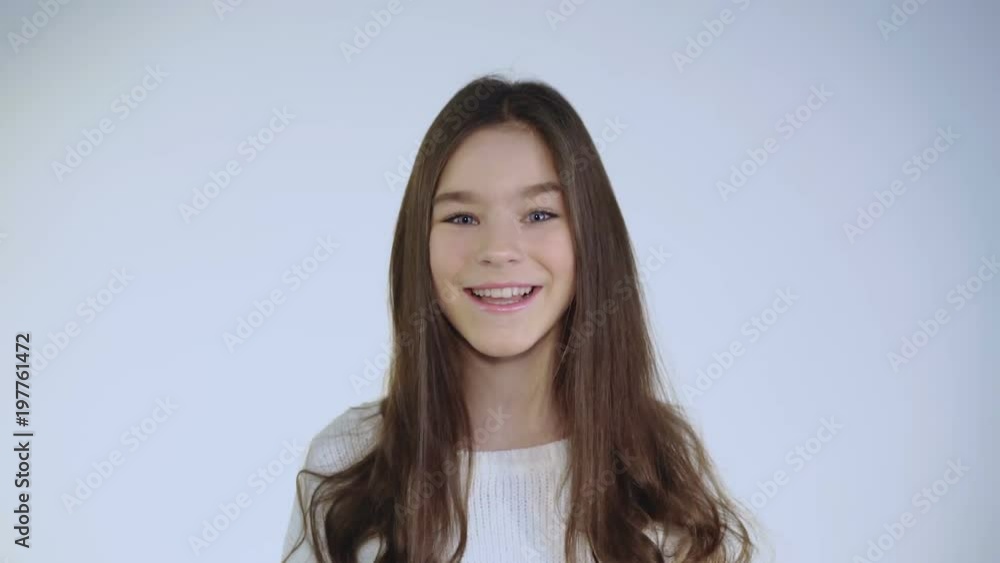 Pretty young brunette plays her hair and coquets at camera Pretty young brunette plays her hair and coquets at camera
