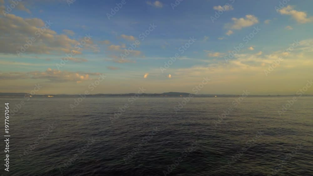 Cargo container ship sailing at dusk Cargo container ship sailing at dusk