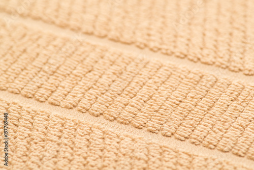 bath towel brown, close-up. textured fabric background
