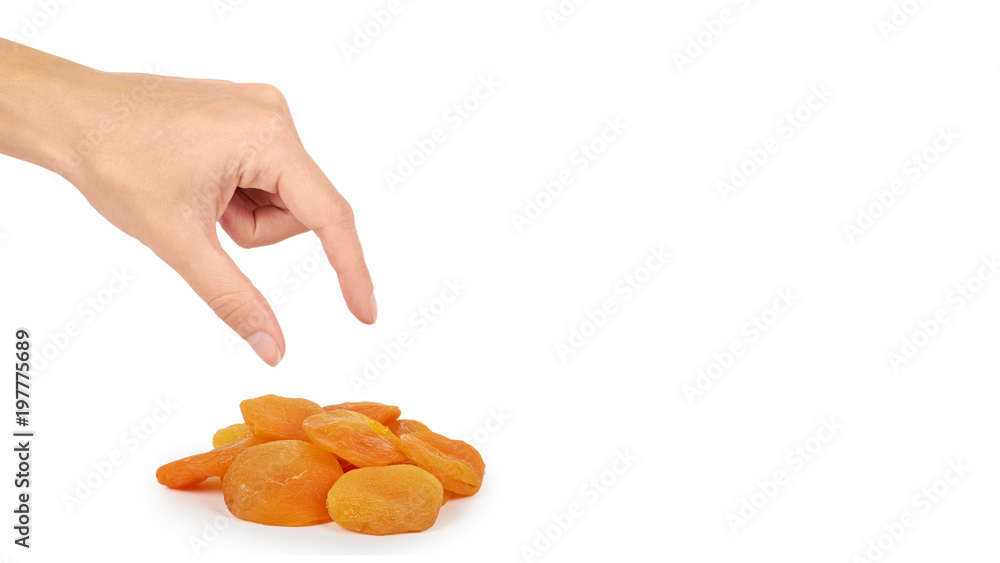 delicious and healthy dried apricots in hand isolated on white background, healthy sweet snack. copy space, template delicious and healthy dried apricots in hand isolated on white background, healthy sweet snack. copy space, template