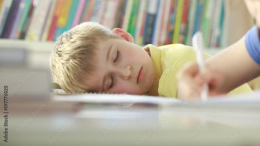Elementary school student sleeping at classroom. Elementary school student sleeping at classroom.
