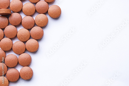 Red vitamin medication pil background