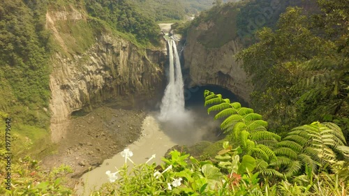 San Rafael,the magnificent 120m tall waterfall in Ecuador,captivates with its breathtaking beauty on a bright and sunny day. photo