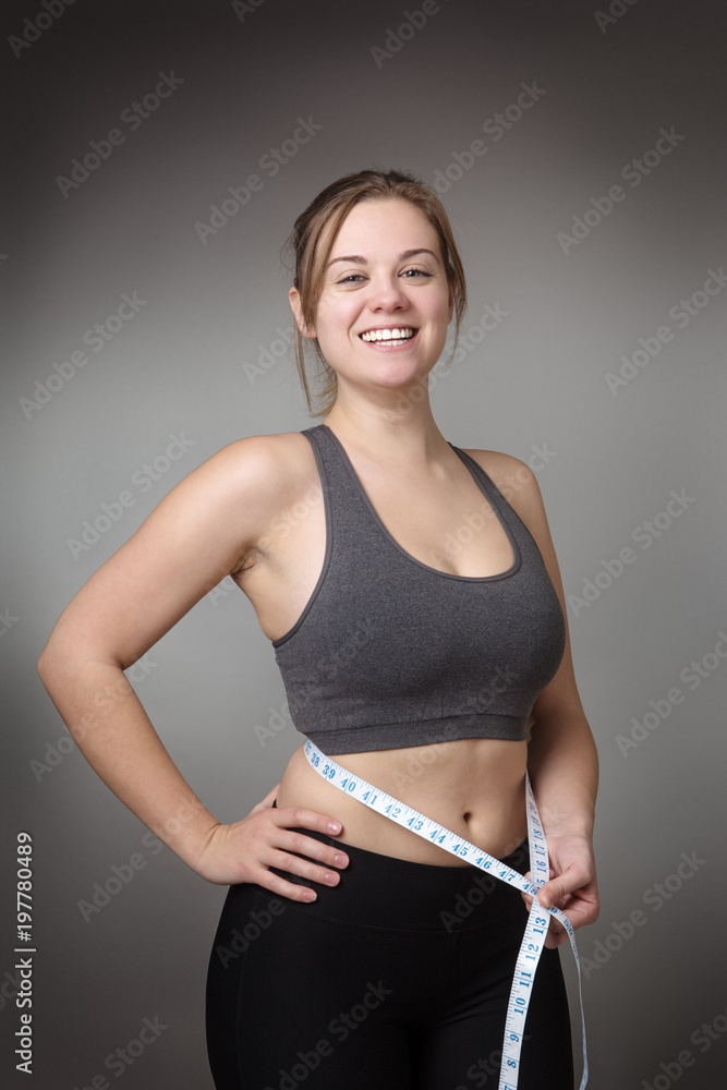 Naklejka premium fitness model on gray background