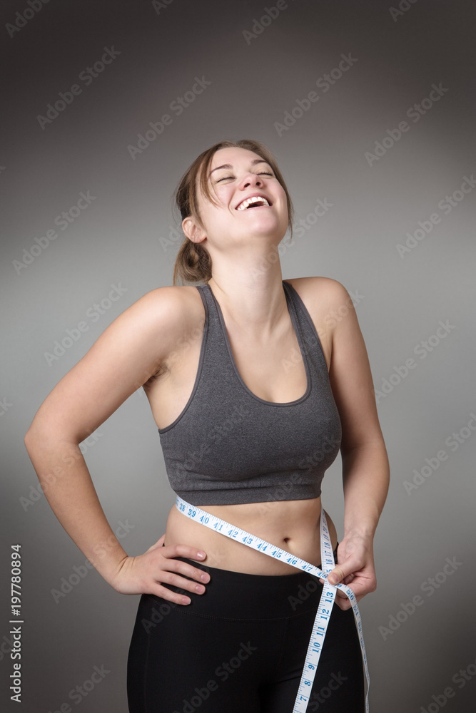 fitness model on gray background