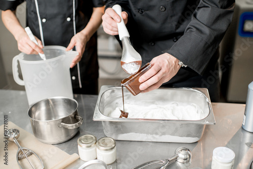 Pouring chocolate in the tray with frozen ice cream